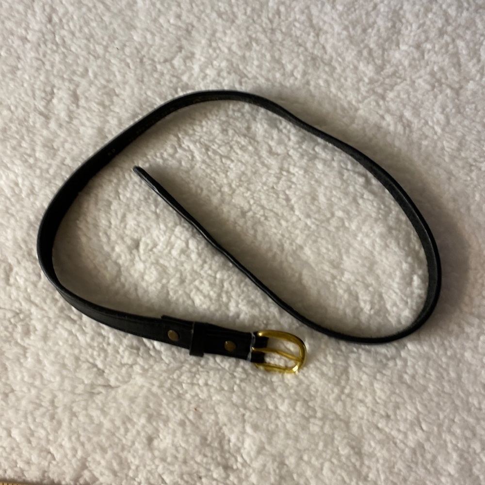 34 inch black leather belt with gold toned buckle.